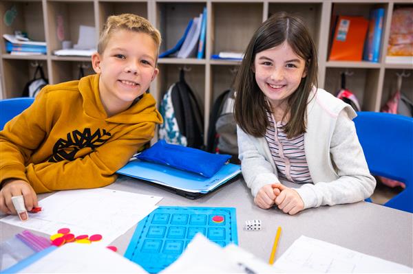 Students inside their classrooms learning. 